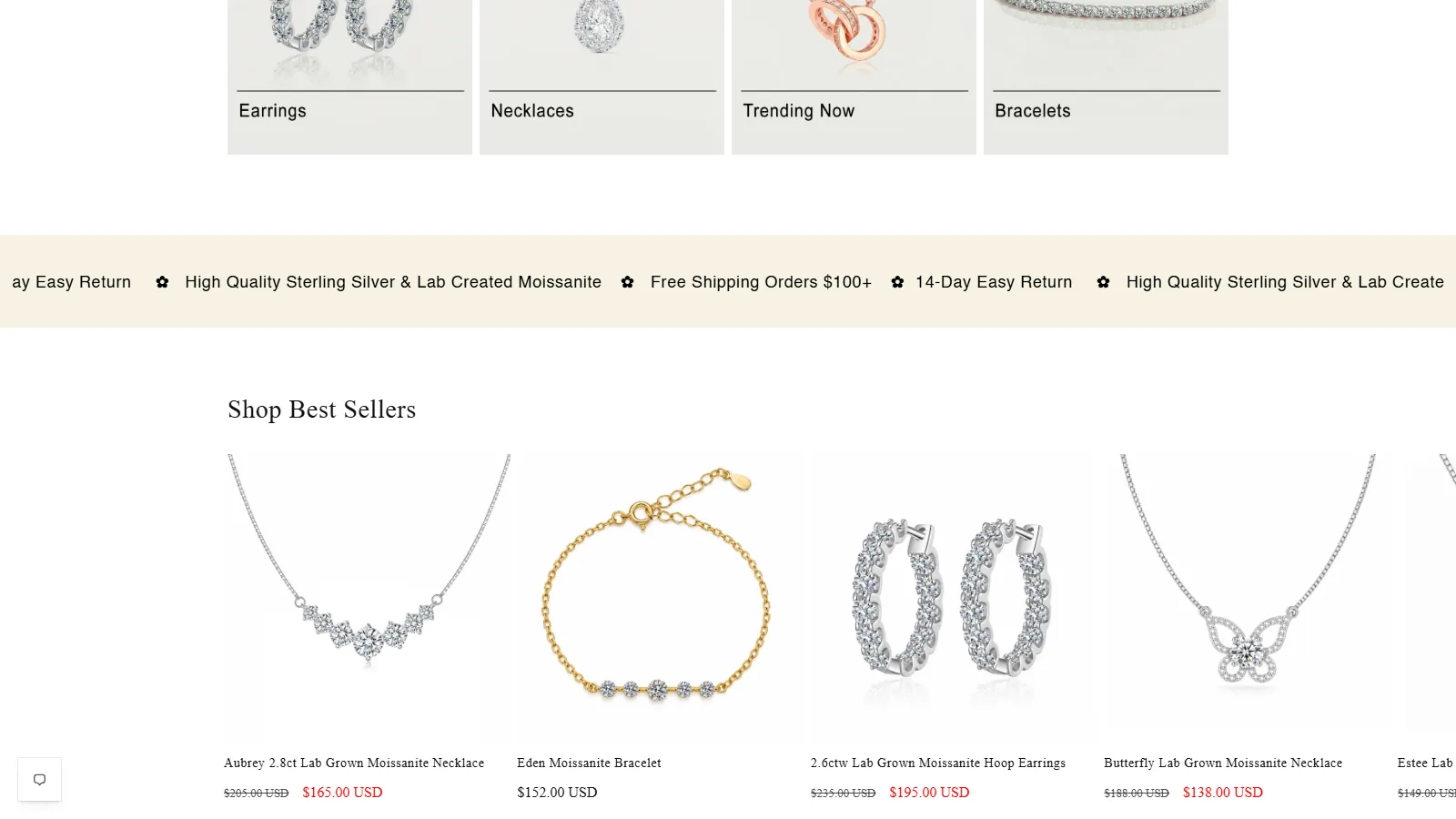 A scrolling strip repeats shipping, returns and materials directly above the best-seller products.